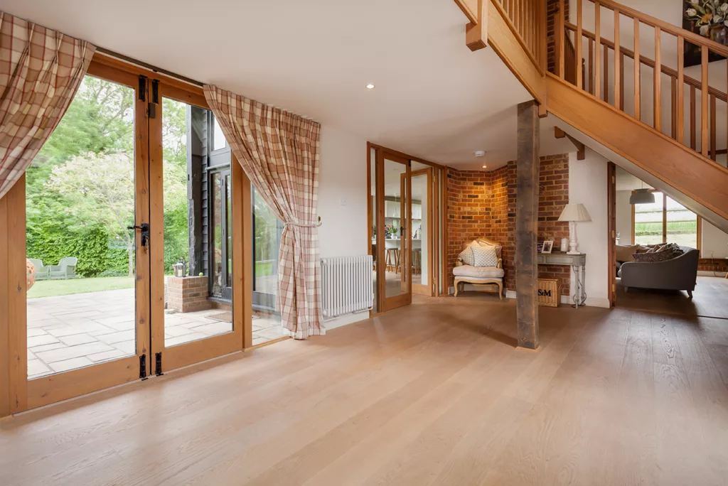 Barn conversion entrance hall with patio doors and stairs
