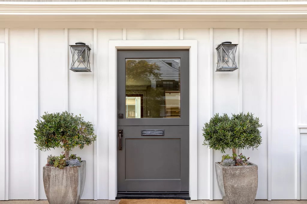 Dark gray front door of classic style home.